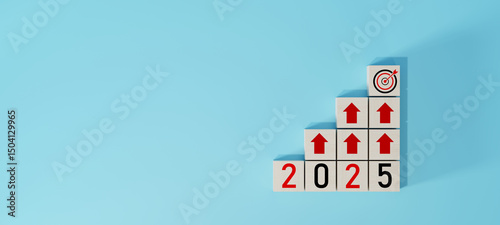 Wooden blocks arranged as stairs with red arrows and 2025 numbers leading to a dartboard target. Concept of business growth, success strategy, and annual goal setting. photo