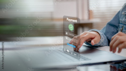 User entering password on secure payment login interface displayed on laptop screen. Concept of online transaction, data protection, digital banking, and cyber security.