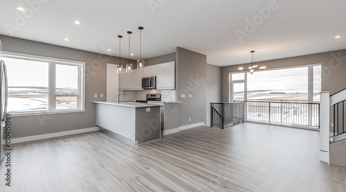 Modern open-concept kitchen and dining area with expansive views