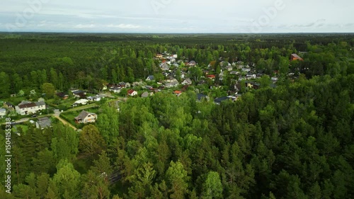 Wallpaper Mural A beautifully captured aerial establishing shot of a serene forest village filmed in real time from above Torontodigital.ca