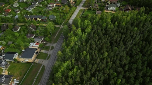 Wallpaper Mural A stunning aerial view captures a serene community that is beautifully bordered by lush green forests all around Torontodigital.ca
