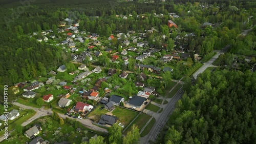 Wallpaper Mural Captivating Aerial Footage Showcasing a Serene Suburban Neighborhood Nestled Amidst Lush Greenery All Around Torontodigital.ca
