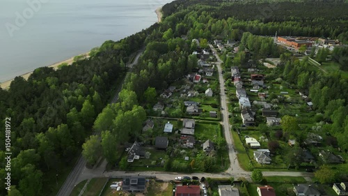 Wallpaper Mural An Aerial View of a Serene Coastal Community Beautifully Surrounded by Lush, Vibrant Greenery and Nature Torontodigital.ca