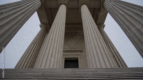 Monumental neoclassical building with massive stone columns and grand staircase

