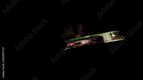 Man Scrolling Smartphone in Total Darkness — Nighttime Mobile Interaction and Focus