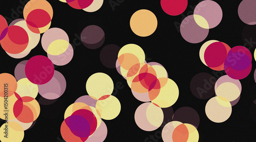 Abstract bokeh lights on a dark background. The image features an array of overlapping circles in a variety of warm colors