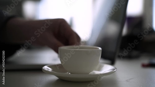 Office Desk Scene with Coffee Pouring from Moka Pot into White Cup