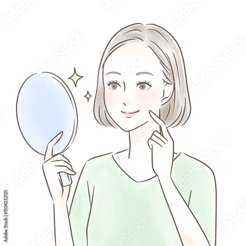 手鏡を見て綺麗な肌に感動する女性