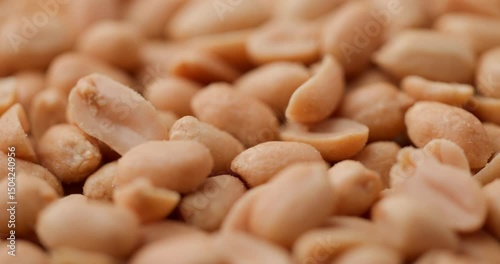 golden roasted peanuts in a detailed close-up, revealing their rich texture and Savory crunch