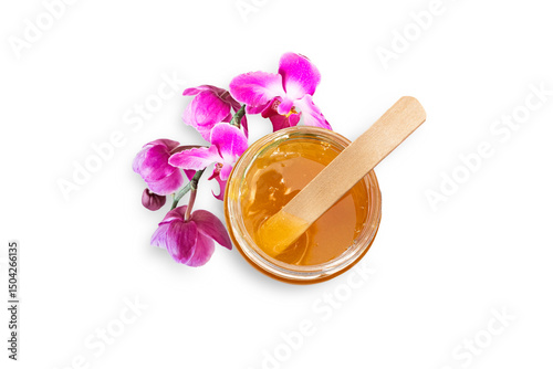 Fotografía Liquid sugar paste for hair removal in bowl with orchid flower on white background