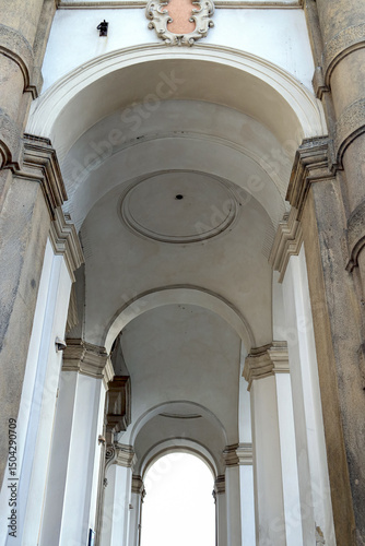 Historic architectural detail of an arch-shaped house facade in Prague, Czech Republic.