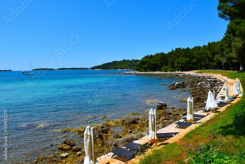 Fototapeta Naklejka Na Ścianę i Meble -  View of a beach near Rovinj at the coast of the Adriatic sea in Istria, Croatia