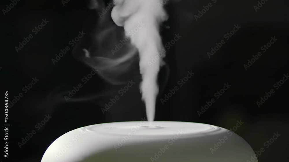 Aromatic diffuser releasing soothing steam in a calm atmosphere.