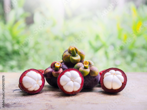 Ripe mangosteen on wooden table. Queen of fruits in Thailand