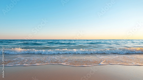 Serene ocean view with gentle waves lapping at sandy shore under clear blue sky. tranquil atmosphere evokes sense of peace and relaxation