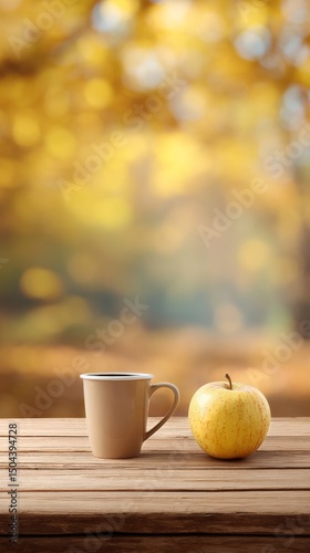 Warm Coffee Cup and Apple on Wooden Table in Autumn Setting With Colorful Leaves