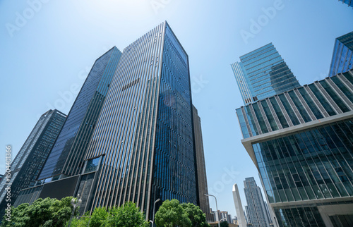 The glass exterior wall of the skyscraper in the financial center