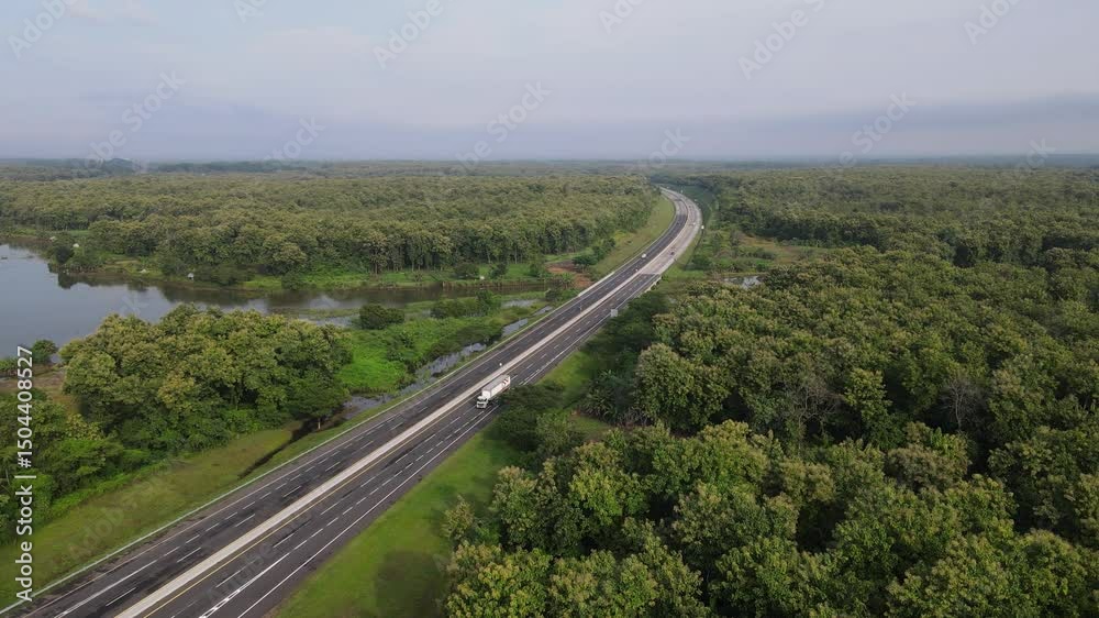 Aerial view of toll road that surrounded by nature in Java, Indonesia. Aerial view of toll road that surrounded by nature in Java, Indonesia.