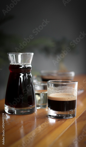 A glass of espresso, manual brew coffee and pour-over coffee (traditional) photo