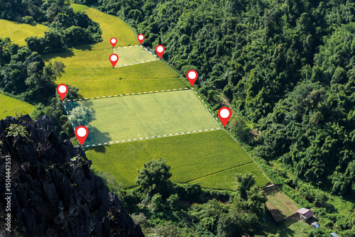 Aerial view of rice fields with location pins and boundary lines in tropical mountain valley farmland area