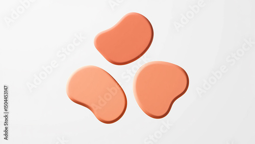 Abstract composition of three organic peach shapes floating on a clean white background
