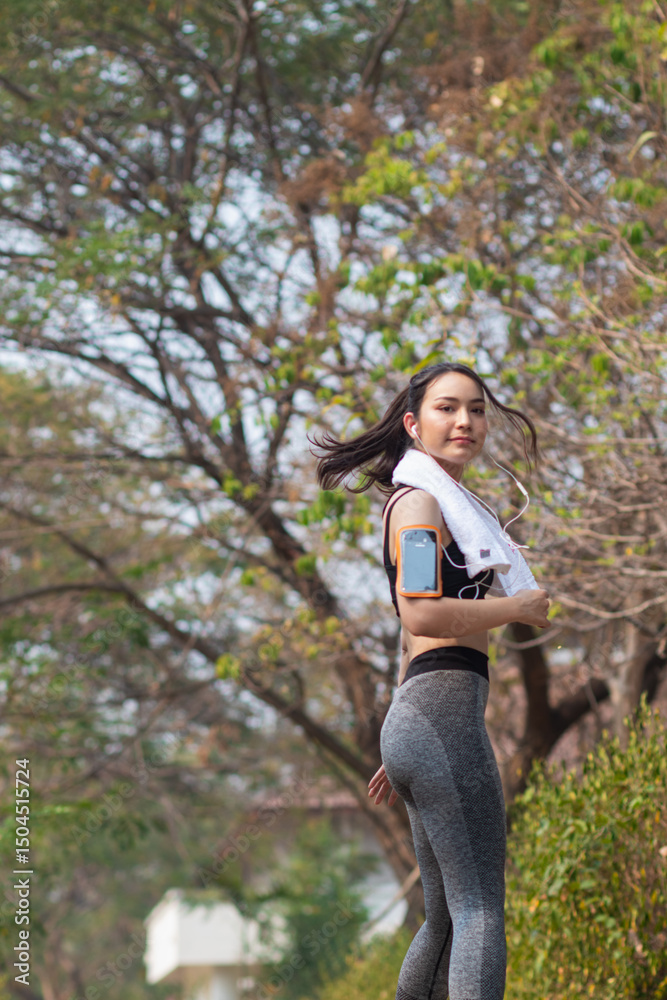 Beautiful Young Asia Woman Run Alone In The Park Because Run Makes Her Healthier And Fitter. Beautiful Asian Woman Smiling Happy While Run In The Park. Beautiful Young Asia Woman Jogging Alone Beautiful Young Asia Woman Run Alone In The Park Because Run Makes Her Healthier And Fitter. Beautiful Asian Woman Smiling Happy While Run In The Park. Beautiful Young Asia Woman Jogging Alone