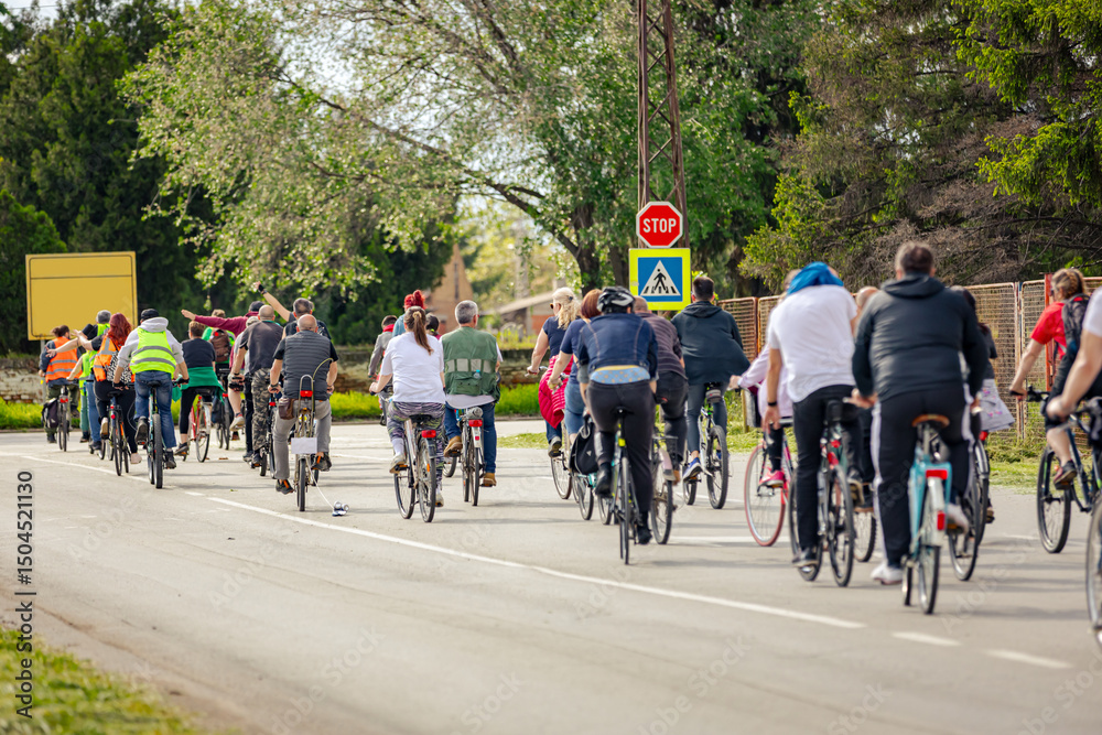 Fototapeta premium Group of cyclists on city road, street, asphalt