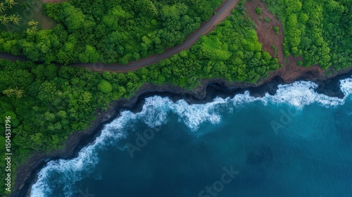 Coastal road amidst lush forest and ocean waves