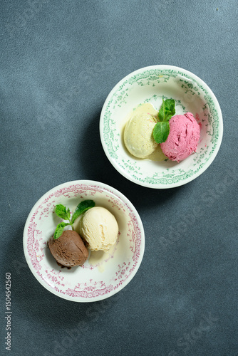 two scoops of ice cream in a bowl 