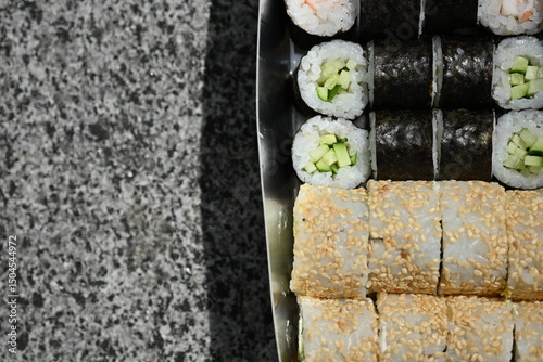 Sushi Rolls in Takeout Box, Street Food Sushi in Paper Box – Close View, Takeaway Sushi Rolls – Close-Up Shot, Japanese Street Food – Sushi Rolls in Cardboard Box, Fresh Sushi Takeout – Macro