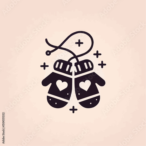 Pair of hanging mittens with hearts on a light background for cozy winter decoration concept