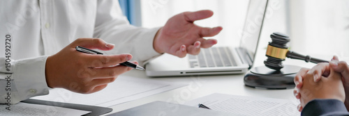 professional lawyer consulting with client about legal contract inside law firm meeting room