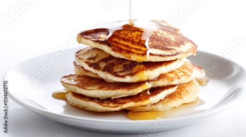Fluffy pancakes drizzled with golden maple syrup in a minimalist setting that captures the essence of a classic breakfast dish with warmth and freshness