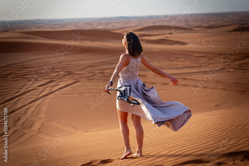 Wallpaper Mural Beautiful girls in a beautiful flowing dress in desert condition Torontodigital.ca