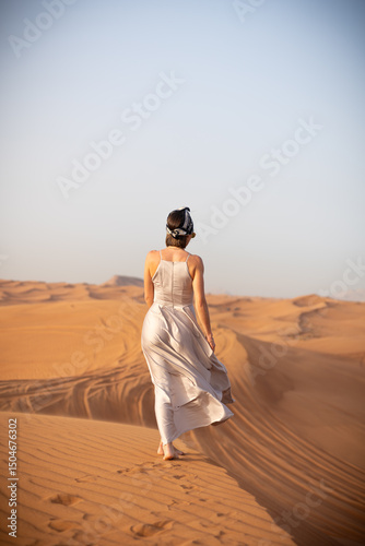 Wallpaper Mural Beautiful girls in a beautiful flowing dress in desert condition Torontodigital.ca