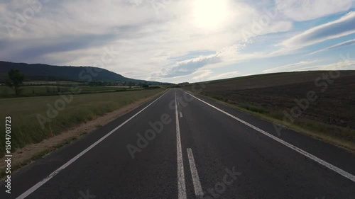 Peaceful Drive Through Sunny Natural Landscape