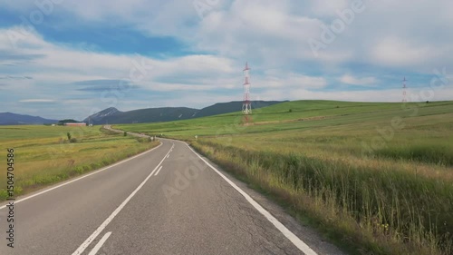 Peaceful Drive Through Sunny Natural Landscape