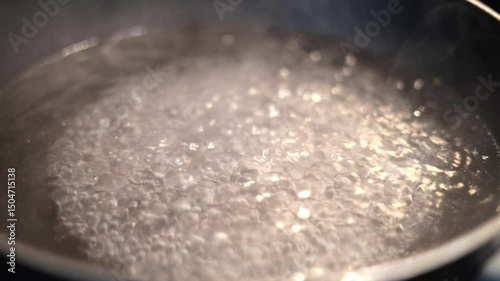 Water Boiling In Pot With Steam
