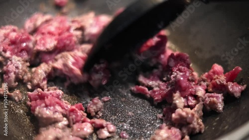 Stirring Sizzling Meat In A Hot Pot