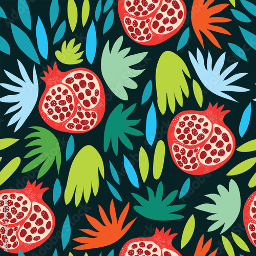  pomegranate pieces with colorful leaves on dark blue background seamless pattern. pomegranate with different colored leaves seamless pattern. It is suitable for tiles, decoration, textile fabric. 