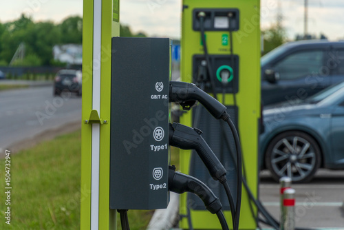 Wall Mural Electric Vehicle Charging Station with Multiple Cables Providing Power to Cars