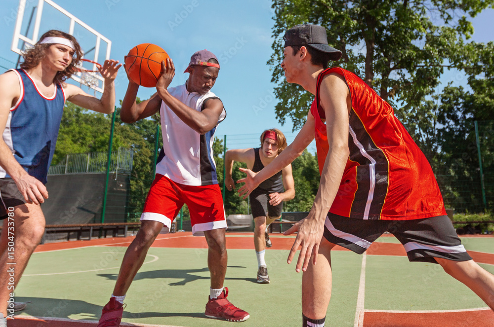 Fototapeta premium Diverse basketball team training for big match at ourdoor sportsground