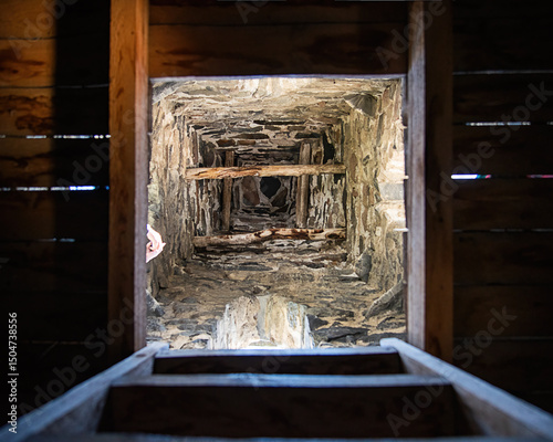 medieval tower Stone tunnel interior. Looking up through a stone shaft. Top view into stone well.