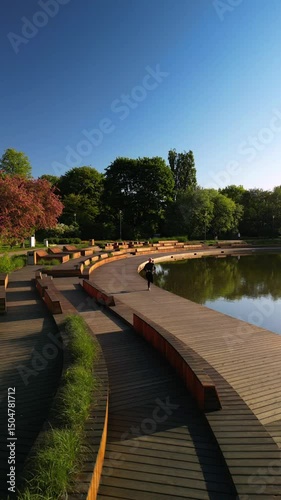Healthy Lifestyle – Man Running by Lake in Warsaw Park, Vertical Aerial View