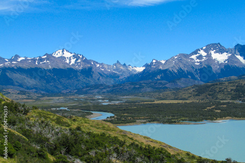 Torres del Paine national park in Patagonia Andes, Chile. South America mountain landscape. Beautiful mountains Torres del Paine on sunny day clear sky at sunrise. Glacier Grey from Paso John Gardner