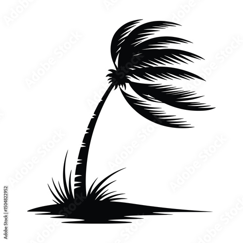 Silhouette of a palm tree bending in the wind