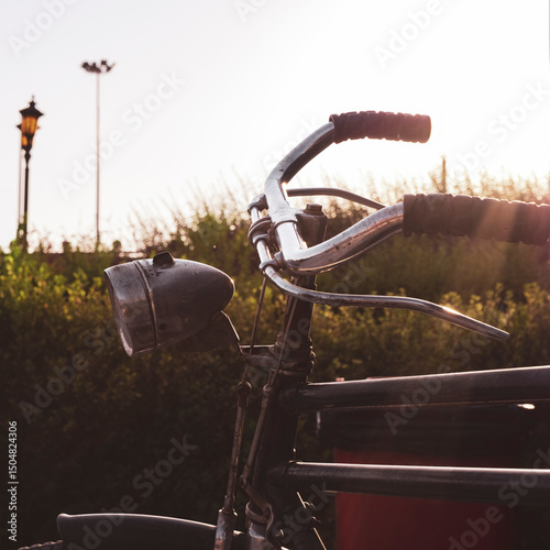 A bicycle at sunset in Amsterdam, the Netherlands. Riding bikes is the main transportation method in the Netherlands.