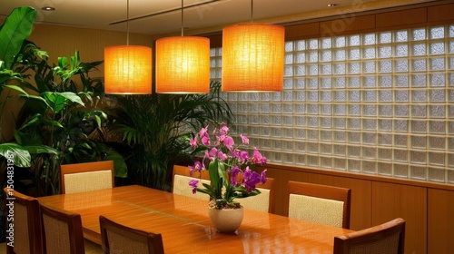 Interior dining area with warm lighting and plants