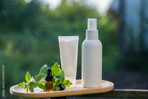 White handmade cosmetic bottles template mockup skin care herbal alternative Insect repellent outdoors during summer. Trying to kill mosquitoes and flies with organic ingredients mint extract oil