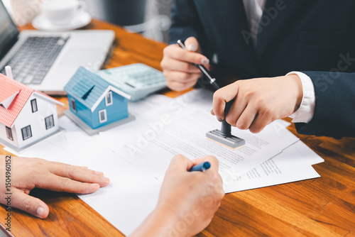 Wallpaper Mural Bank approve loan to buy home concept. Real estate agent talked about terms of home purchase agreement, asked customer to sign documents to make contract legally. approved mortgage application form. Torontodigital.ca